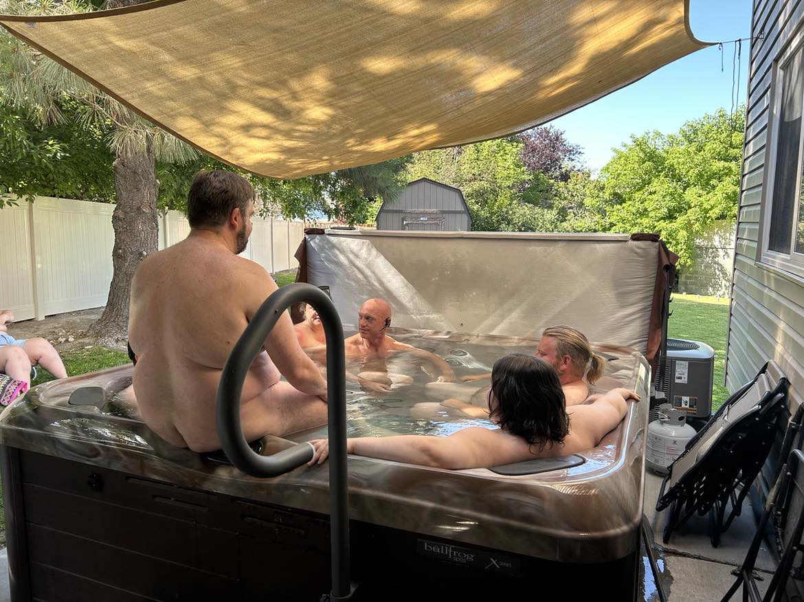 Guests and hosts enjoying the backyark 8 person jacuzzi available.